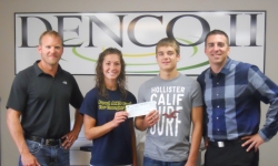 Mick Miller-DENCO II General Manager, and Bryce Jones of Growth Energy present a check to MAHS FFA members Rachel Moser and Tony Domnick. FFA members will be competing in the National competion in October with their presentation of 